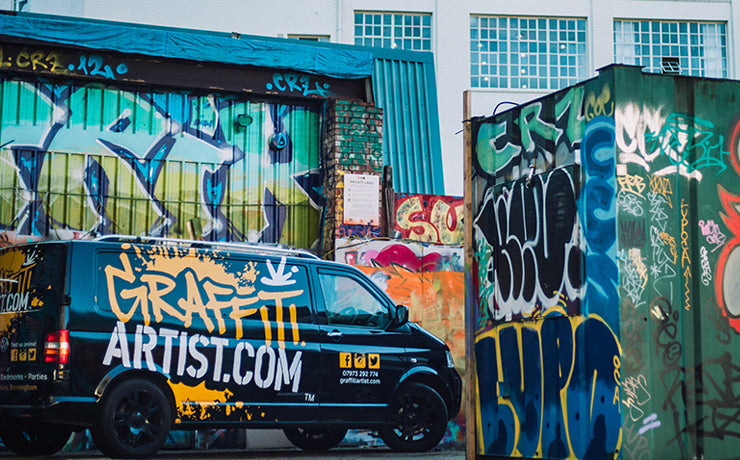 Graffiti artist spray painting spot