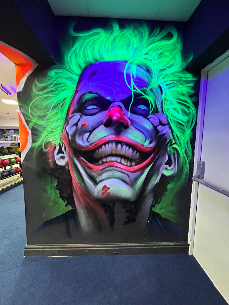 Colorful mask with glowing green hair on a dark background