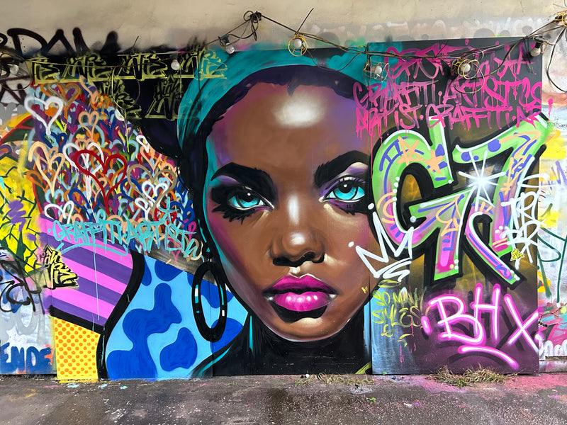 Graffiti art with a colorful face design and street art elements.