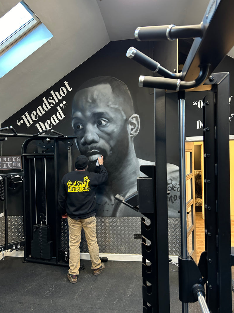 Graffiti mural of Leon Edwards in a home gym